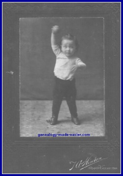 Young boy with ball in 1907